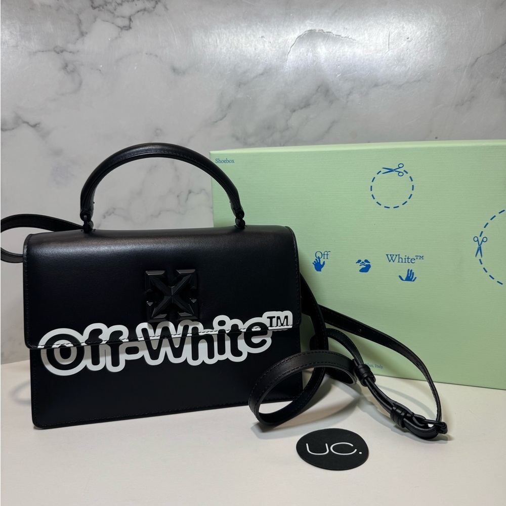 Off-White Jitney 1.4 leather top handle bag with removable crossbody strap.